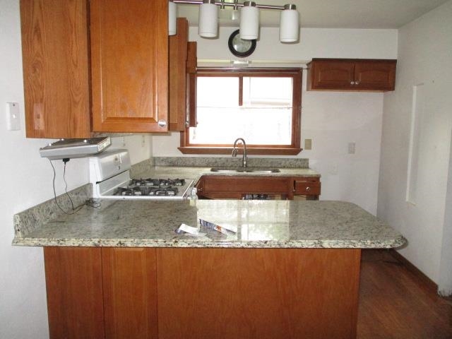424 North 10th Street Rochelle, IL 61068 - Photo 3 of 22 a bathroom with a granite countertop sink and a mirror