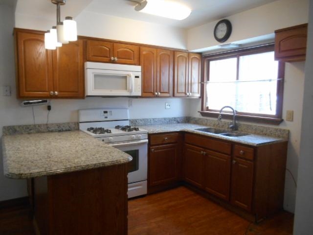 424 North 10th Street Rochelle, IL 61068 - Photo 4 of 22 a kitchen with stainless steel appliances granite countertop a sink stove and cabinets