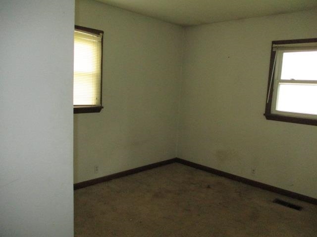 424 North 10th Street Rochelle, IL 61068 - Photo 10 of 22 an empty room with a window