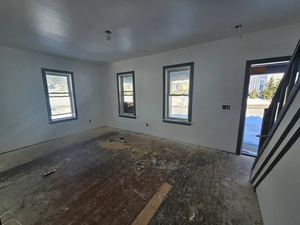 a view of an empty room with windows