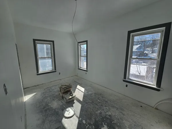a view of an empty room and window