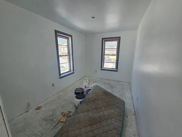 a view of an empty room with windows