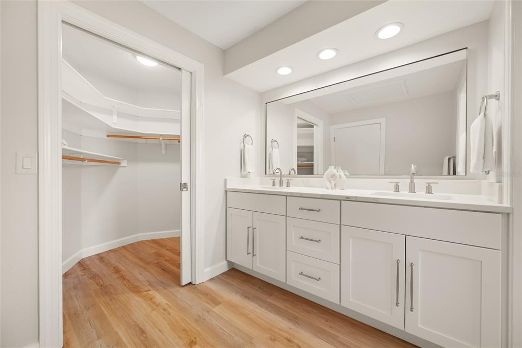 656 Mehlenbacher Road Belleair, FL 33756 - Photo 26 of 49 a bathroom with a double vanity sink and mirror