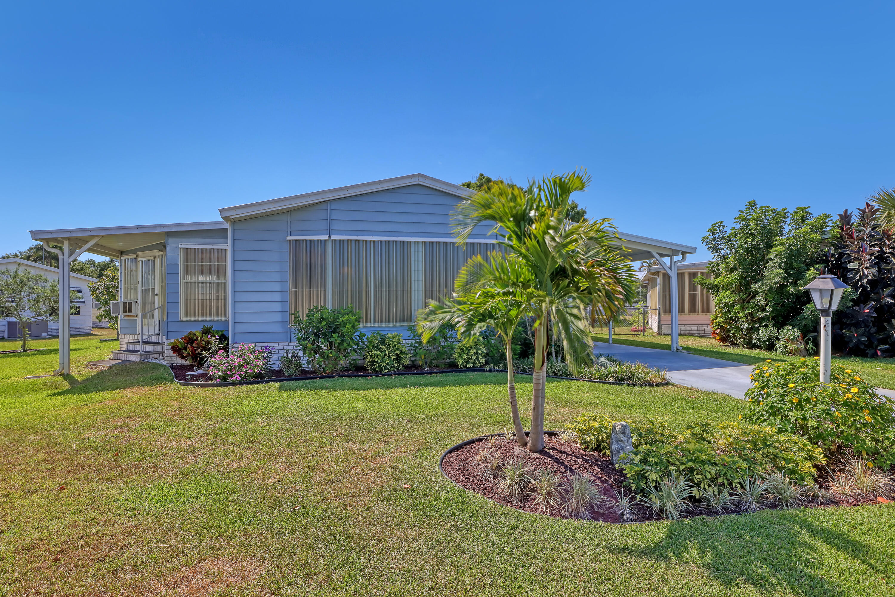 464 Dolphin Circle Barefoot Bay, FL 32976 - Photo 2 of 42 a view of a house with swimming pool and porch