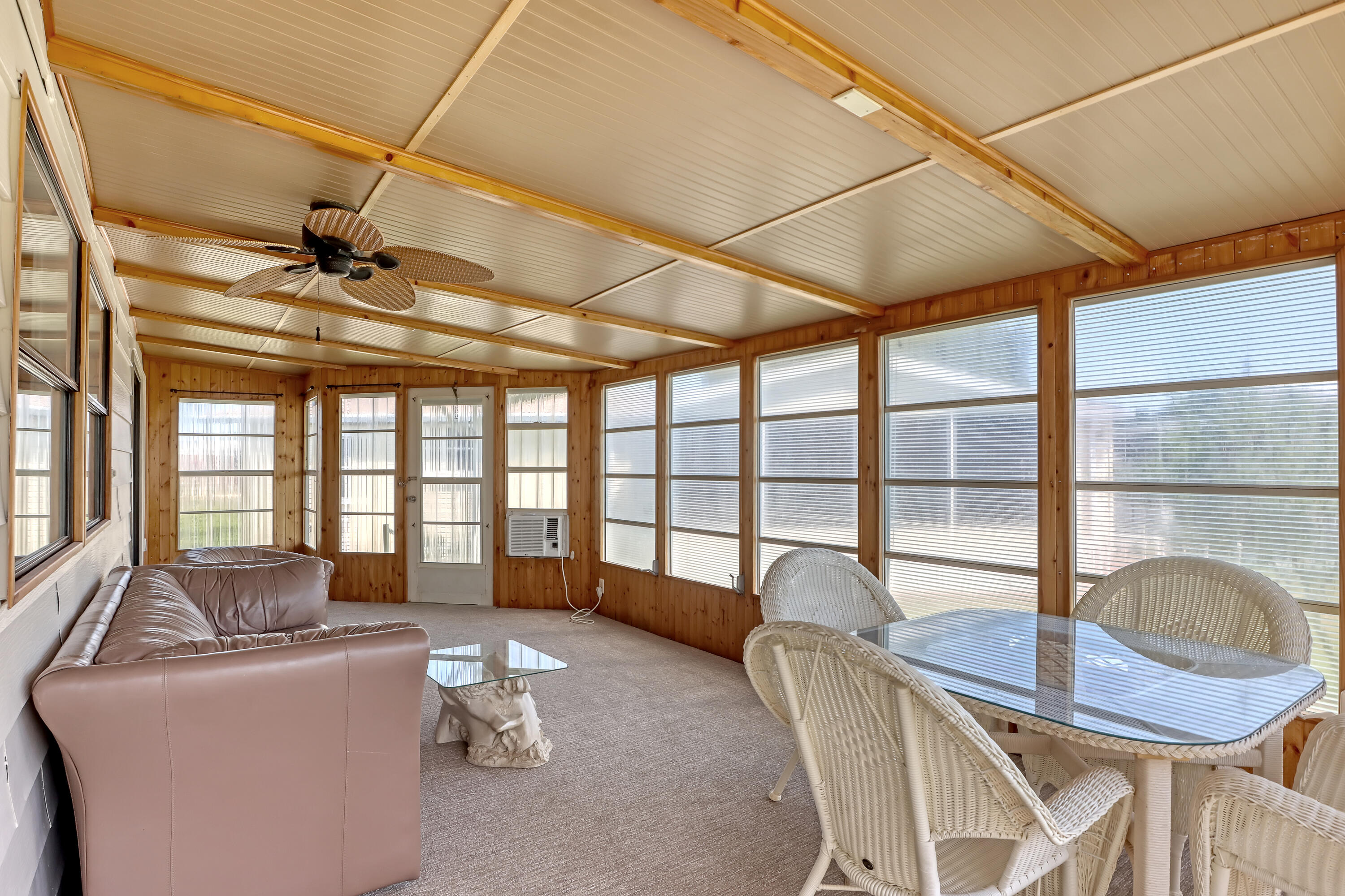 464 Dolphin Circle Barefoot Bay, FL 32976 - Photo 25 of 42 a living room with furniture and a window