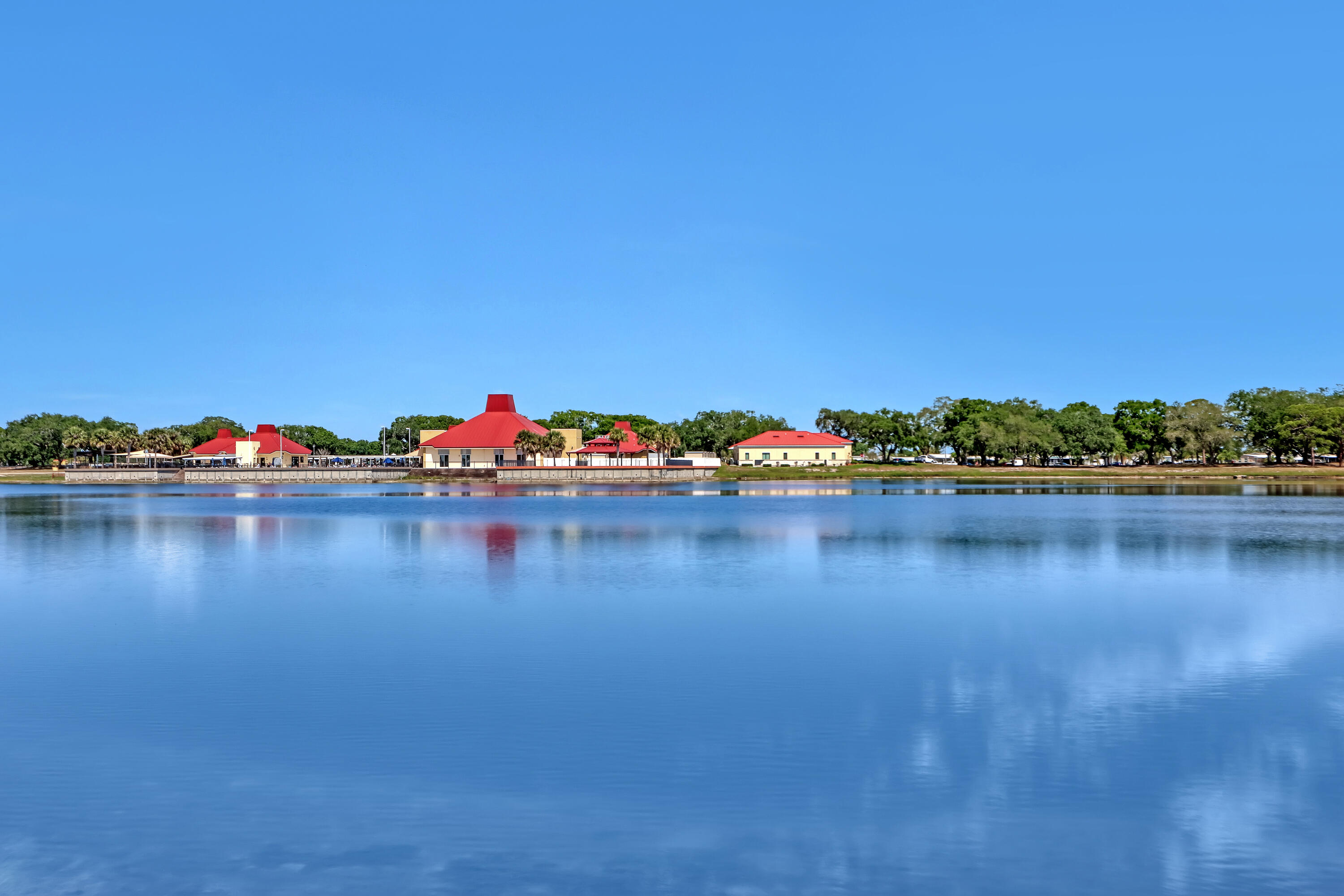 464 Dolphin Circle Barefoot Bay, FL 32976 - Photo 32 of 42 a view of a lake with houses