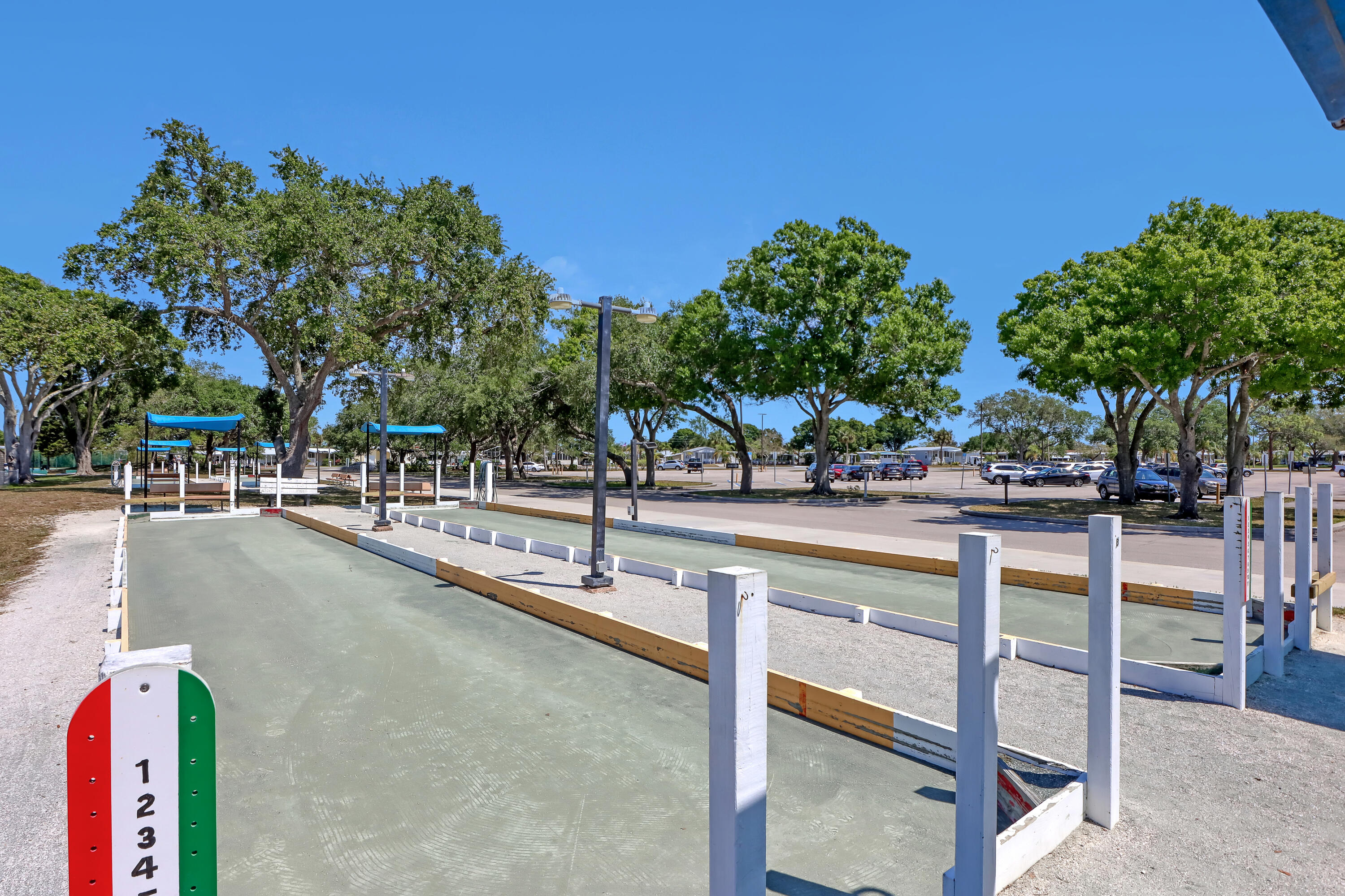 464 Dolphin Circle Barefoot Bay, FL 32976 - Photo 38 of 42 a view of a park with swings and slides