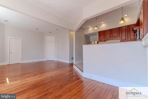 a kitchen with stainless steel appliances granite countertop a refrigerator stove and sink