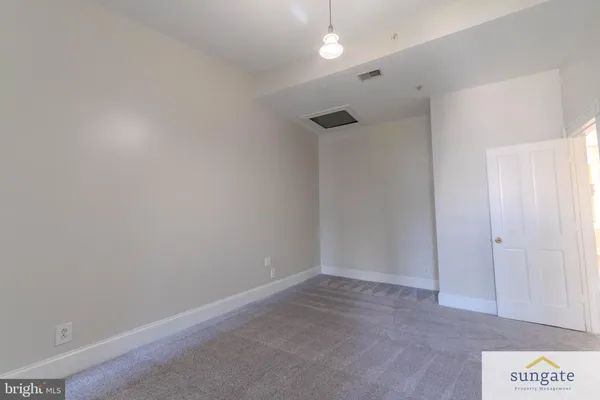 a bathroom with a bathtub and a sink