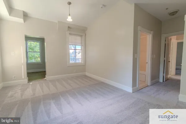 a view of a porch with wooden floor and fence