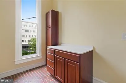 a kitchen with a stove and a refrigerator