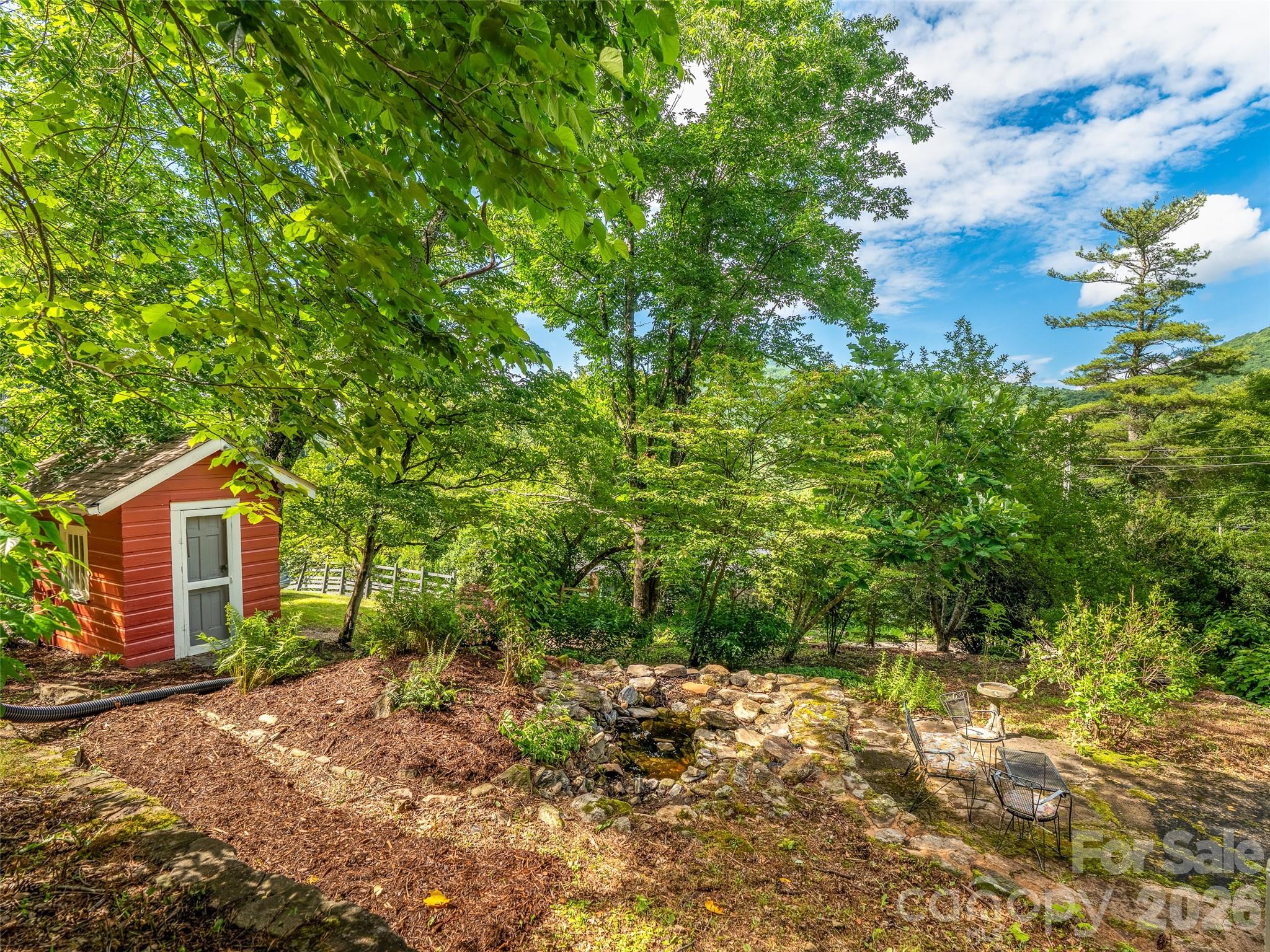 206 Chestnut Hill Road Gerton, NC 28735 - Photo 39 of 48 a backyard of a house with lots of green space