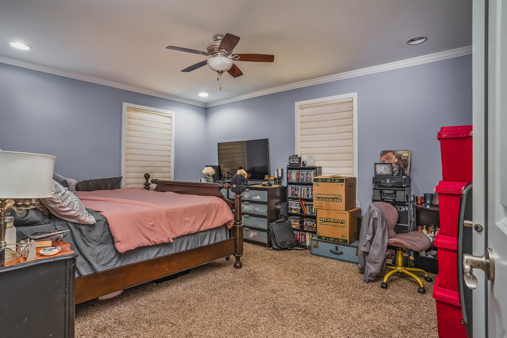 1013 Bode Road Elgin, IL 60120 - Photo 7 of 9 a bedroom with bed a desk and gym equipment