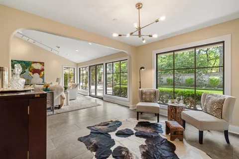 a large white kitchen with a large window