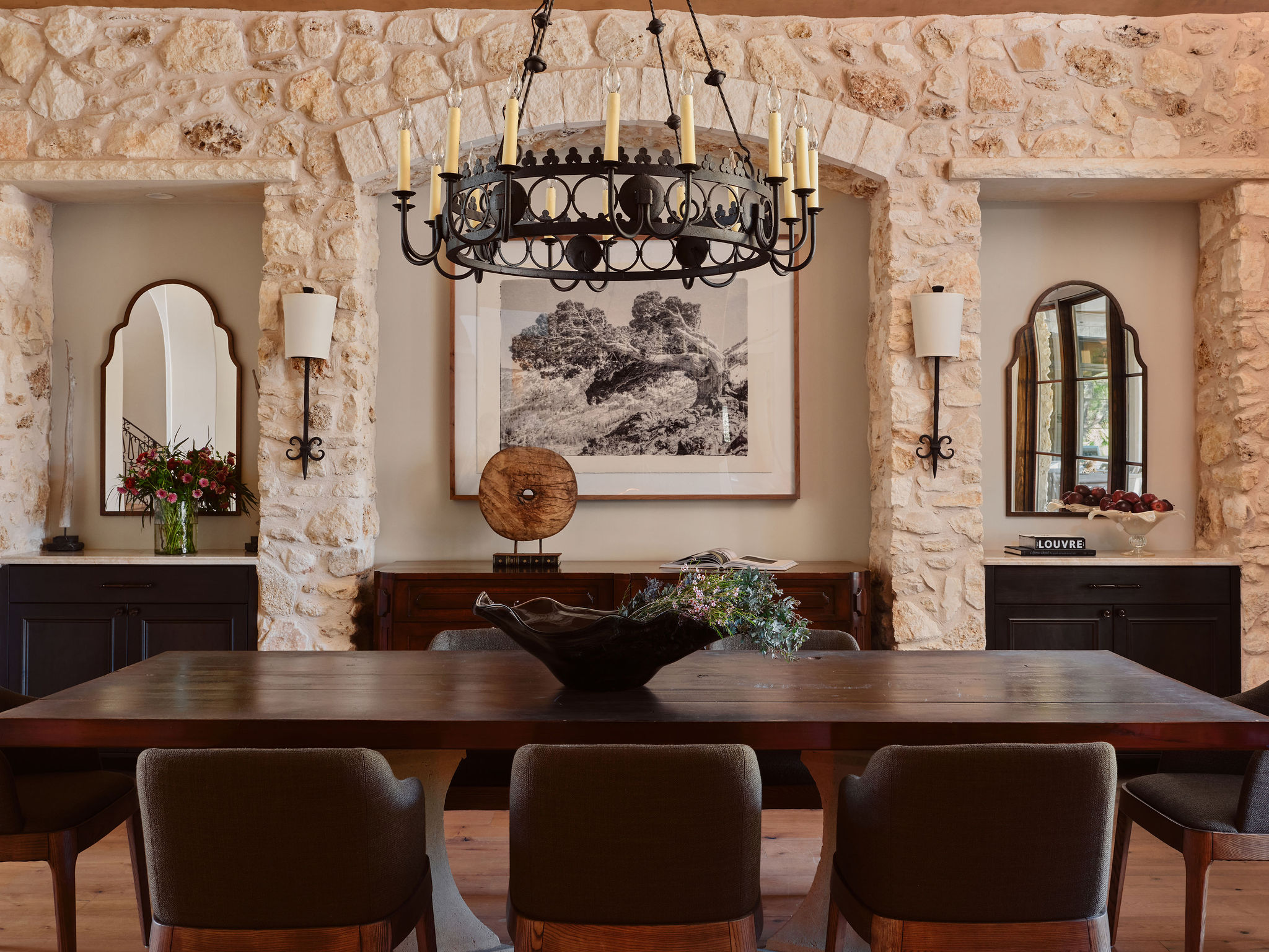 3667 Stoneridge Road Austin, TX 78746 - Photo 8 of 40 The dining room offers a wine grotto vibe, featuring native Texas limestone walls and built in cabinetry.