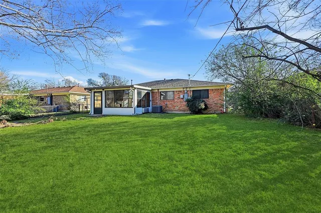 a view of a house with a big yard