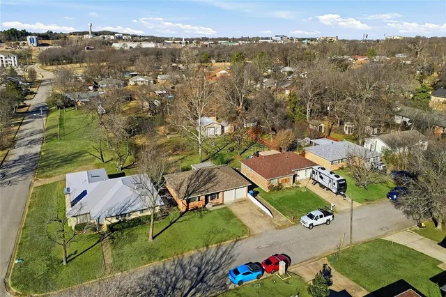 an aerial view of residential houses with outdoor space