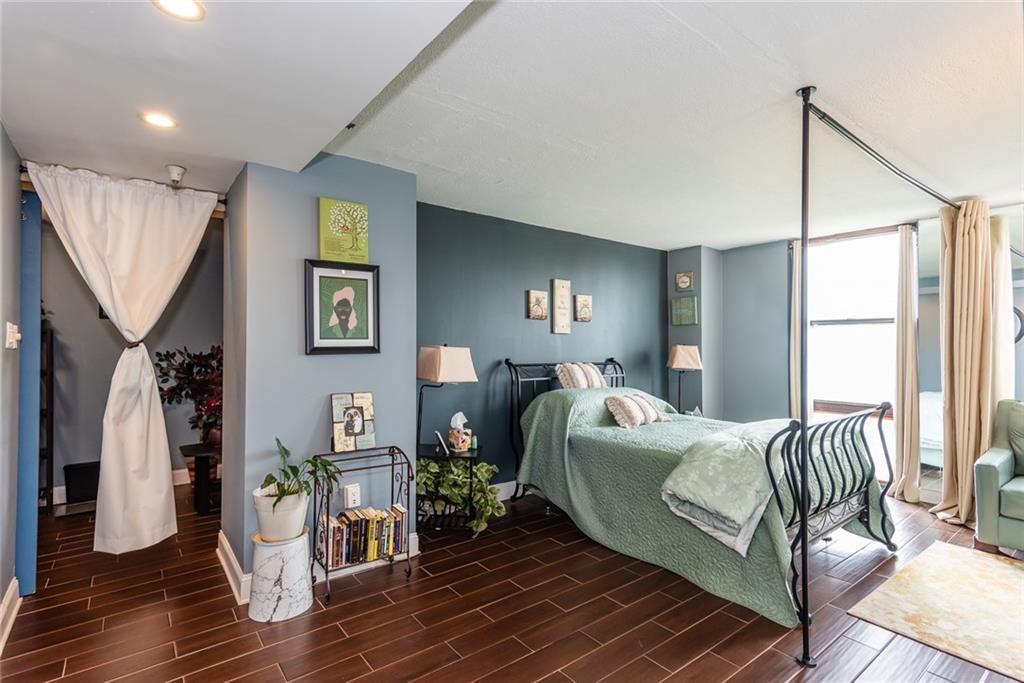 375 Ralph McGill Boulevard Northeast, Unit 1701 Atlanta, GA 30312 - Photo 17 of 33 a bed room with a bed and a window