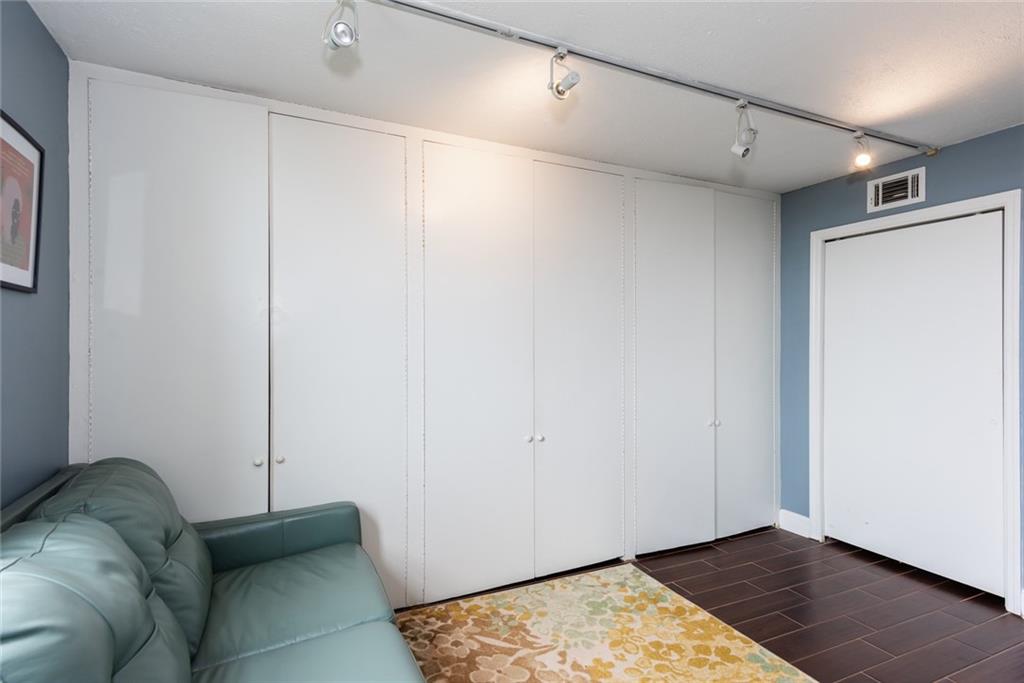 375 Ralph McGill Boulevard Northeast, Unit 1701 Atlanta, GA 30312 - Photo 21 of 33 a view of livingroom with furniture and wooden floor
