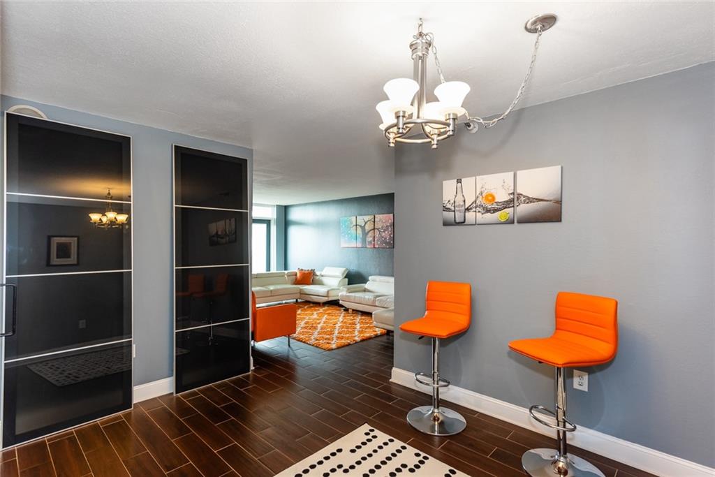 375 Ralph McGill Boulevard Northeast, Unit 1701 Atlanta, GA 30312 - Photo 5 of 33 a dining room with furniture and chandelier