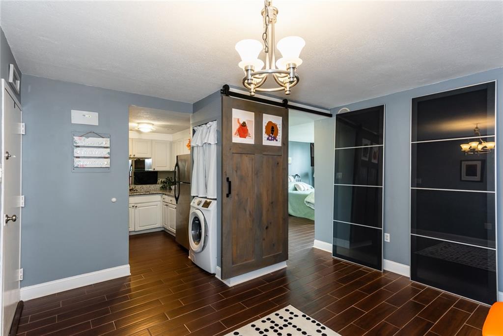 375 Ralph McGill Boulevard Northeast, Unit 1701 Atlanta, GA 30312 - Photo 6 of 33 a kitchen with stainless steel appliances granite countertop a refrigerator and a stove top oven