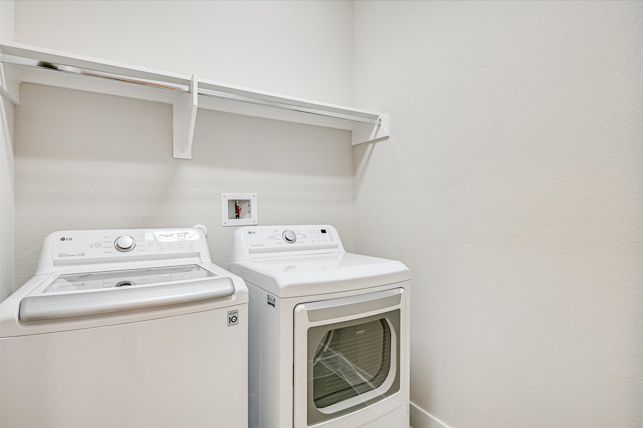 6136 Florencia Lane Austin, TX 78724 - Photo 19 of 40 Laundry room with washing machine and clothes dryer