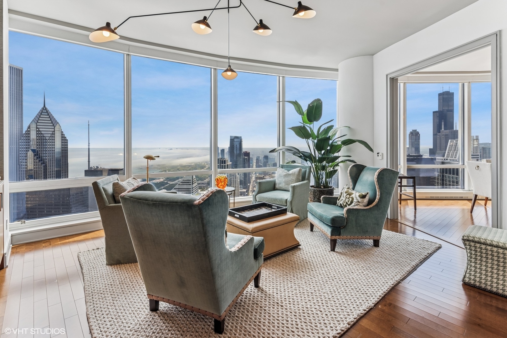 401 North Wabash Avenue, Unit 54E Chicago, IL 60611 - Photo 11 of 29 a living room with large couches and a dining table with garden view