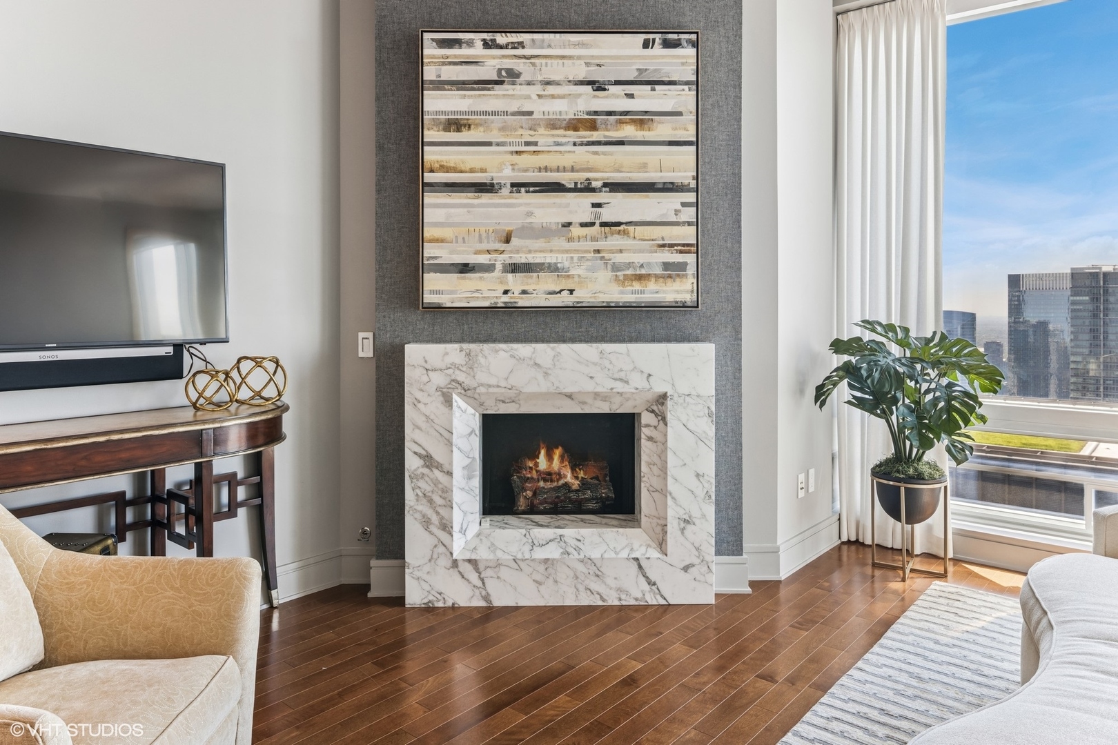 401 North Wabash Avenue, Unit 54E Chicago, IL 60611 - Photo 15 of 29 a living room with furniture and a fireplace