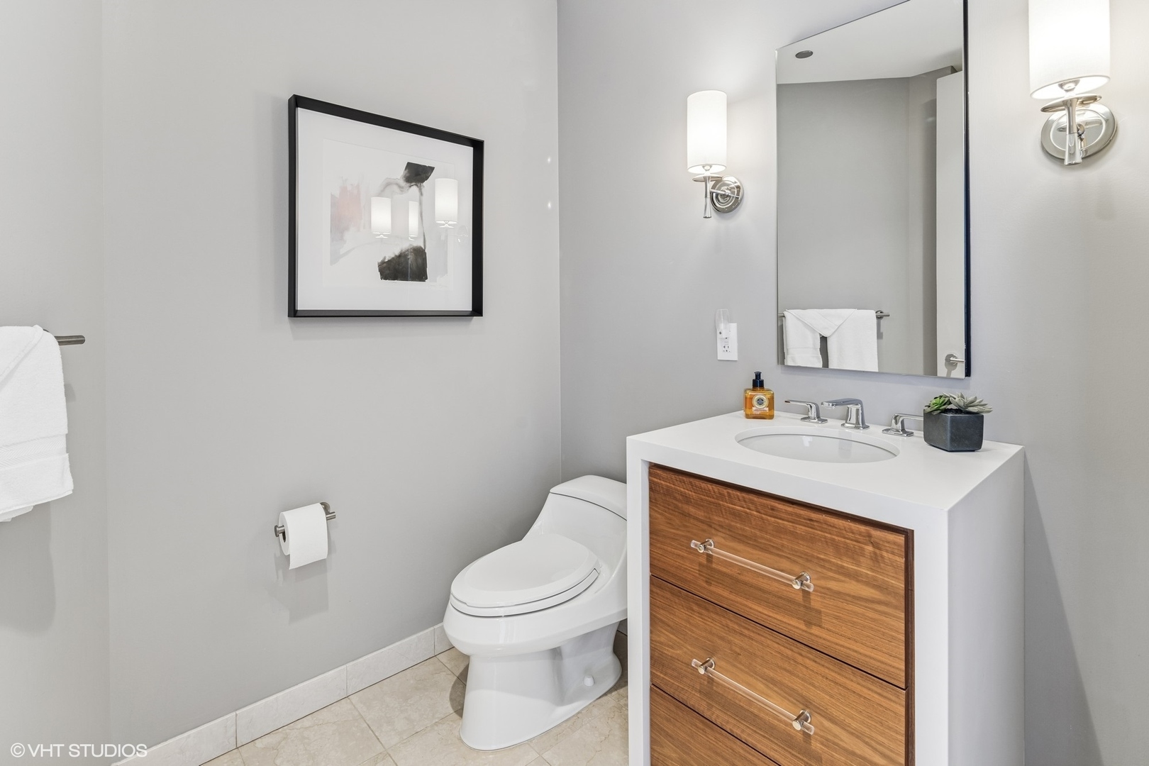 401 North Wabash Avenue, Unit 54E Chicago, IL 60611 - Photo 21 of 29 a bathroom with a toilet sink vanity and mirror