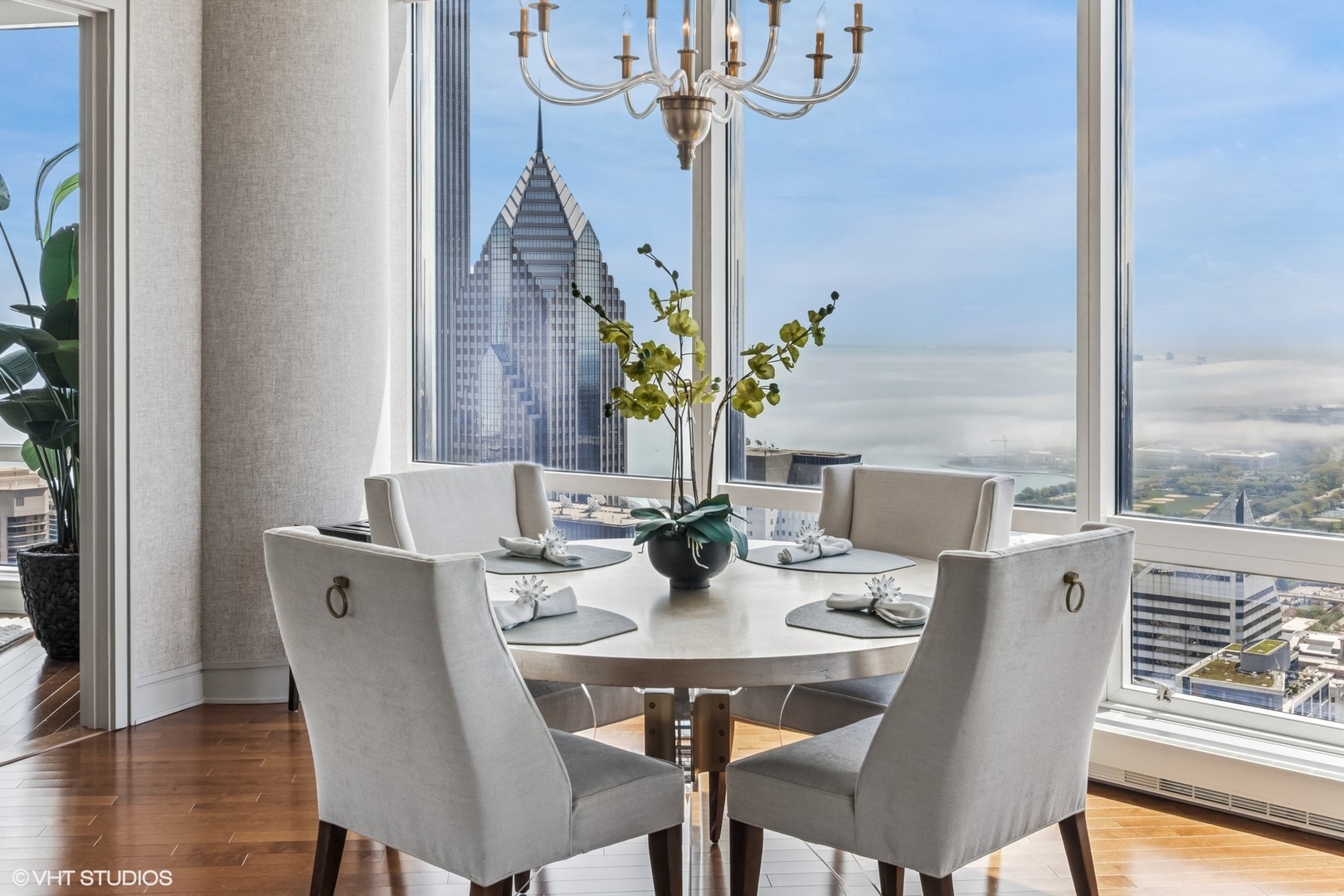 401 North Wabash Avenue, Unit 54E Chicago, IL 60611 - Photo 8 of 29 a view of a dining room with furniture window and wooden floor