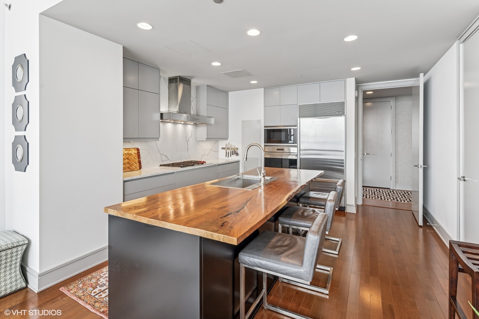 401 North Wabash Avenue, Unit 54E Chicago, IL 60611 - Photo 9 of 29 a kitchen with kitchen island a counter top space appliances and cabinets