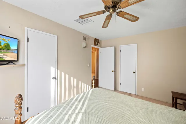 a bathroom with a toilet a sink and a mirror