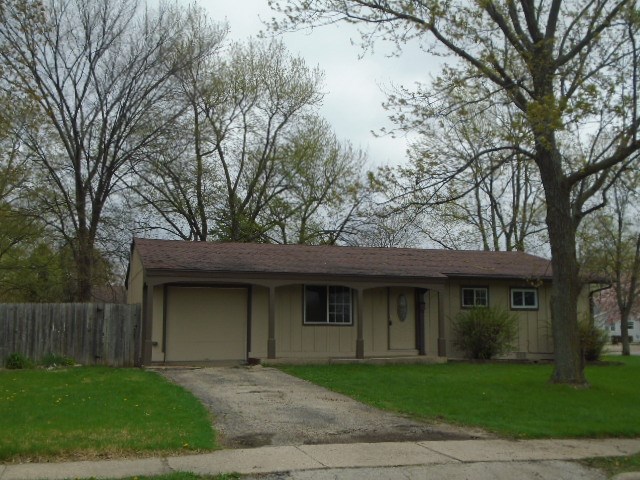 2120 South Alpine Road Rockford, IL 61108 - Photo 1 of 12 a front view of a house with a garden and trees