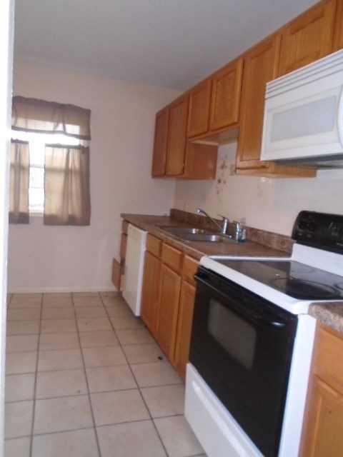 2120 South Alpine Road Rockford, IL 61108 - Photo 5 of 12 a kitchen with a stove and a sink
