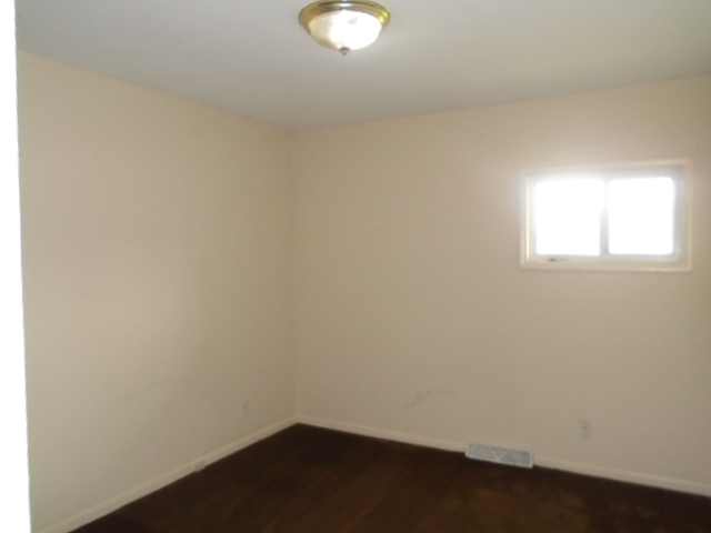 2120 South Alpine Road Rockford, IL 61108 - Photo 7 of 12 an empty room with a window