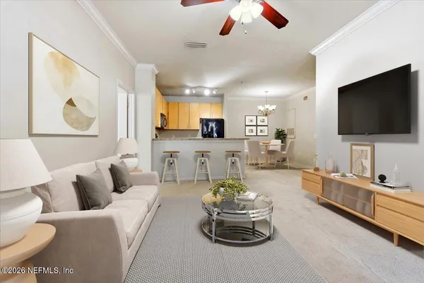 a living room with furniture and a flat screen tv