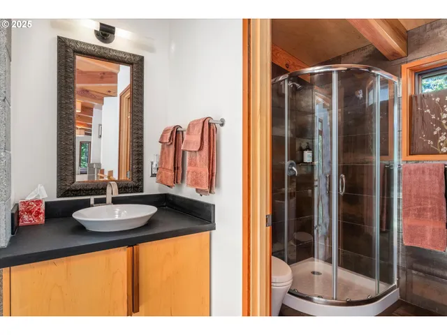 a bathroom with a tub sink and shower