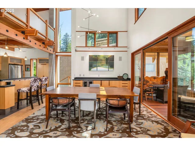 a dining hall view with a large window table and chairs