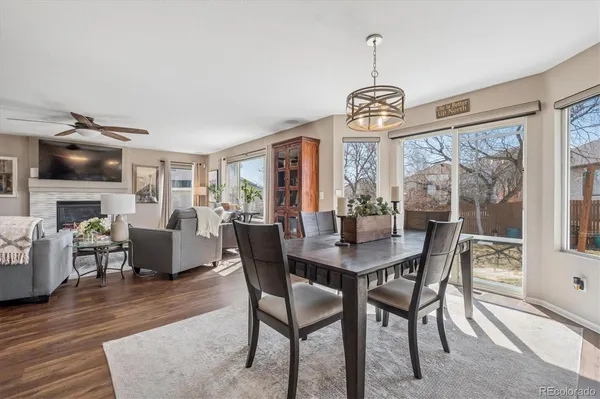a view of a dining room with furniture window and wooden floor