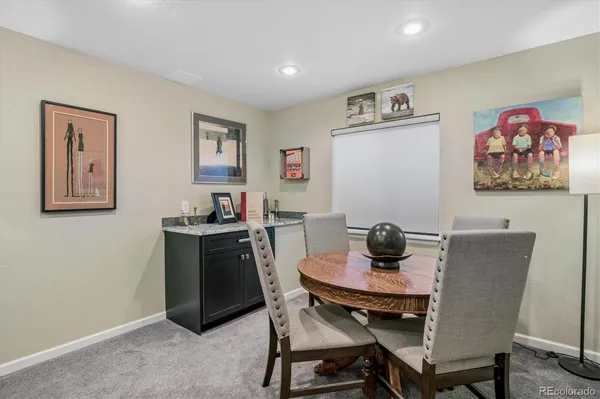 a dining room with furniture and window