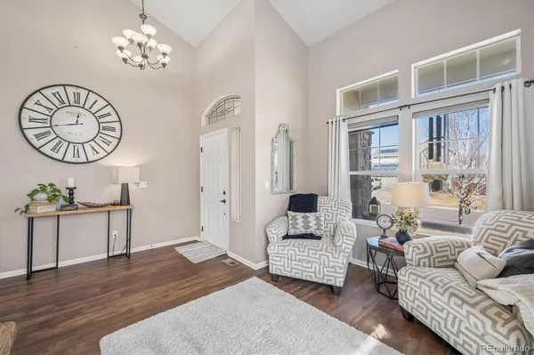 a living room with furniture a table and decor