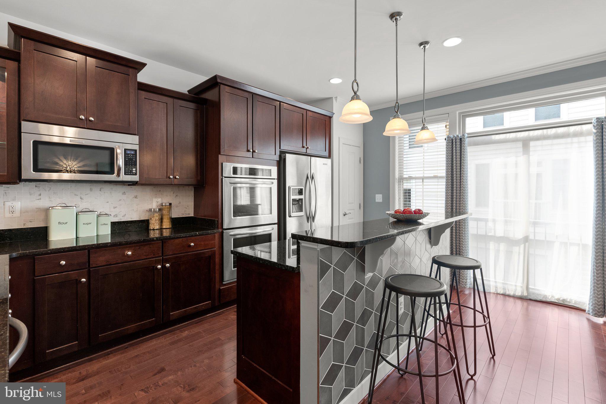 3315 Kemper Road Arlington, VA 22206 - Photo 16 of 52 Breakfast bar with pendant lighting