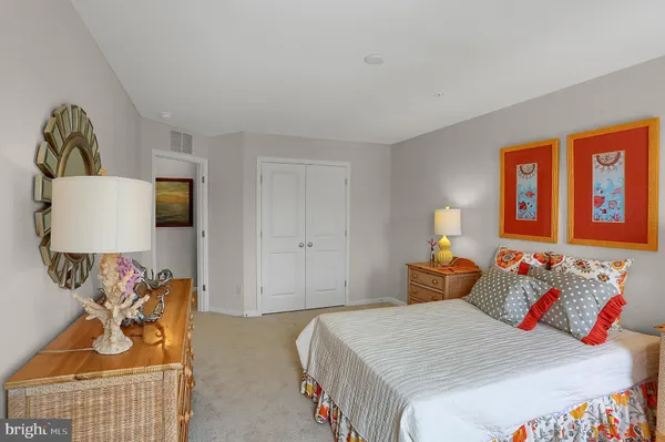 a bedroom with bed and window