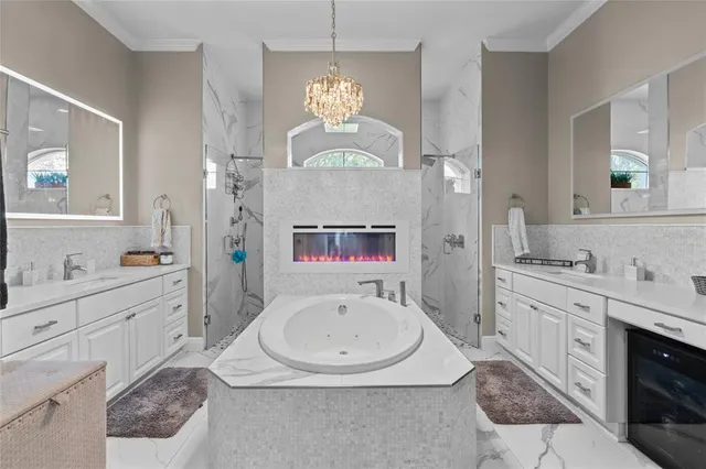 a bedroom with a bed dresser and flat screen tv