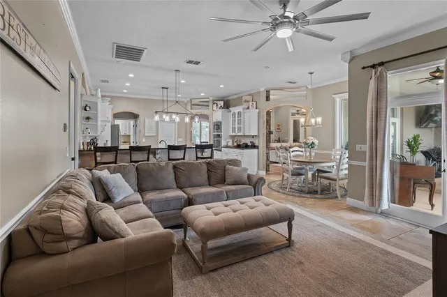 an aerial view of a house with a swimming pool yard and outdoor seating