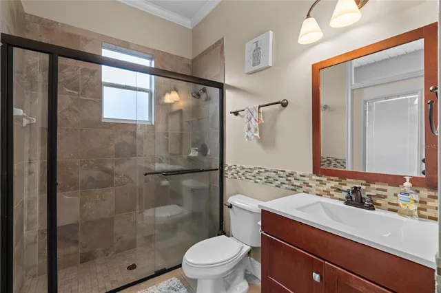 an aerial view of a house with a garden lake view