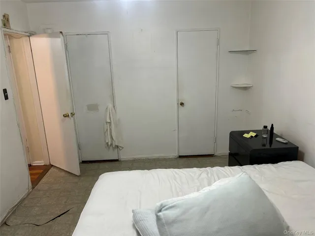 a bedroom with a bed and a shower
