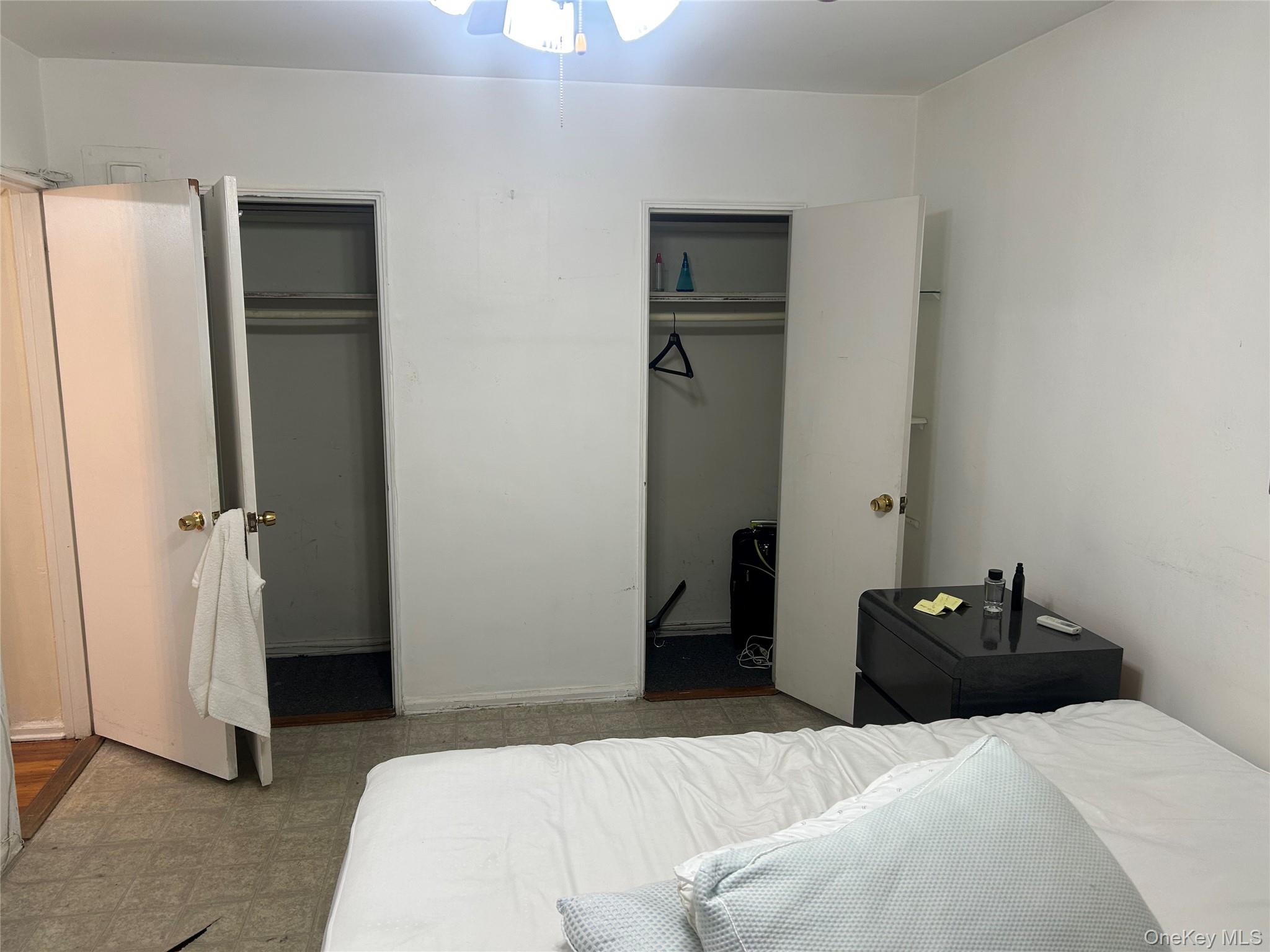 83-20 98th Street, Unit 5J Queens, NY 11421 - Photo 13 of 17 a bedroom with a bed and wooden floor