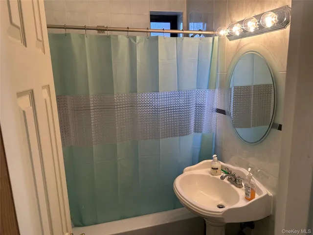 a bathroom with a sink a mirror and vanity
