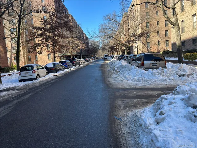 a view of street with parked cars